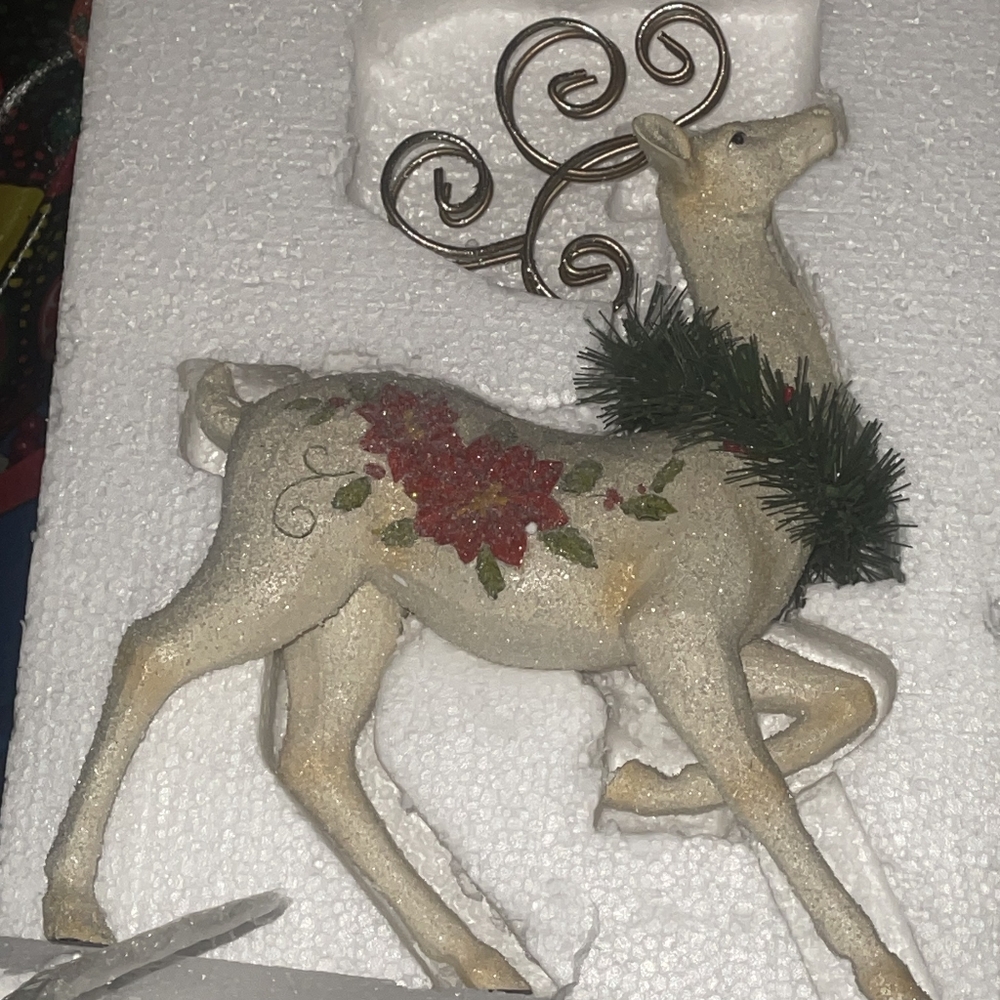 Pointsetta reindeer statue